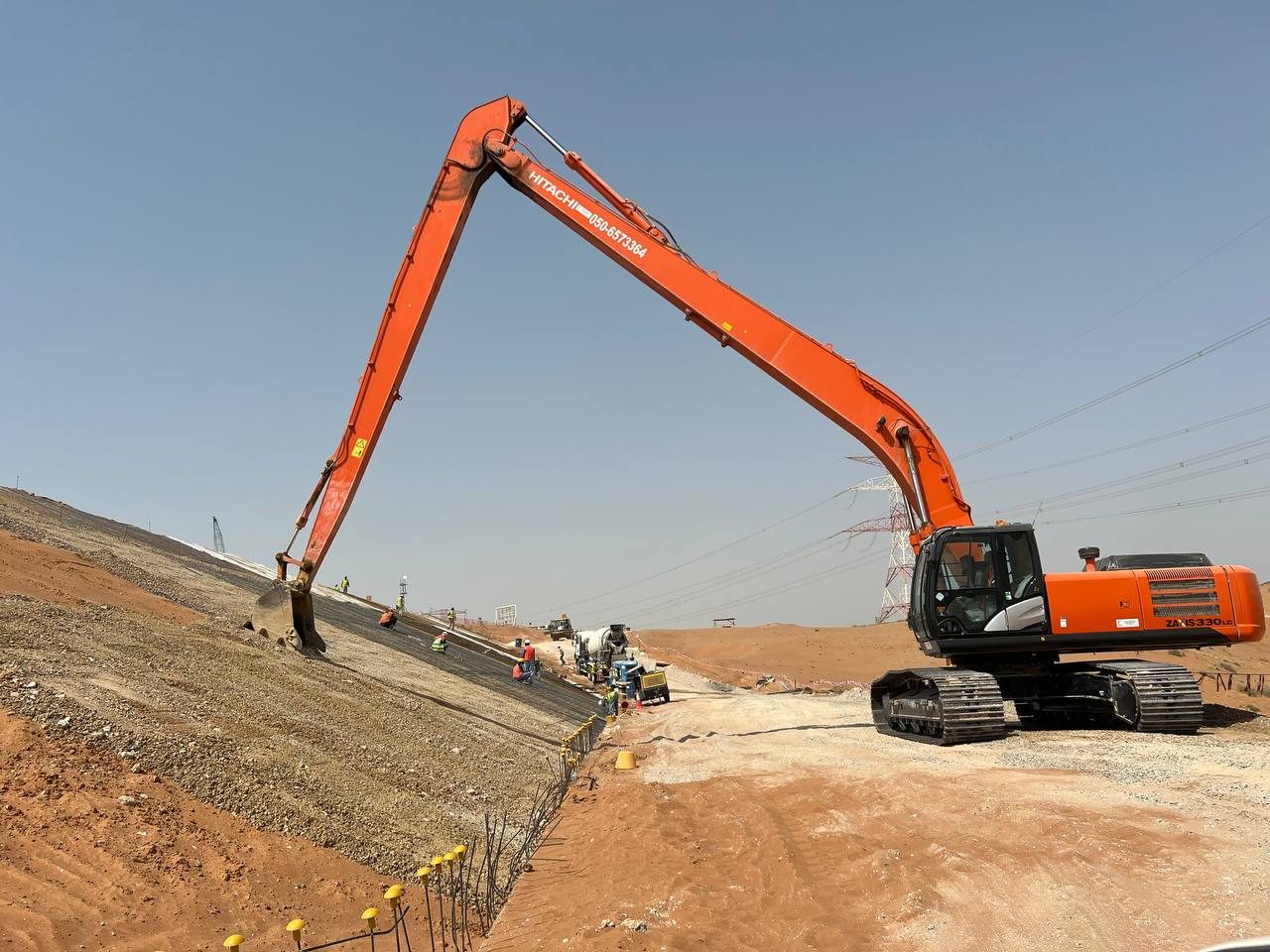 MACO Hitachi ZAXIS 330 long-boom excavator on slope works