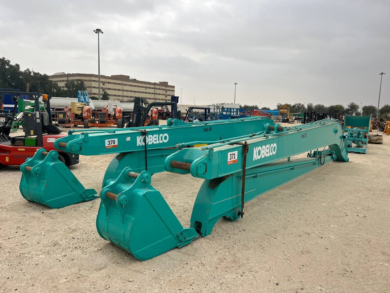 MACO Kobelco long-boom attachments at the fleet yard